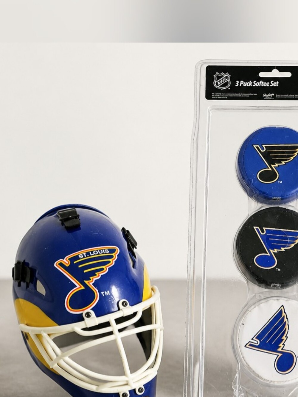 St. Louis Blues Riddell Mini Hockey Mask & 3 NHL Softee Pucks Bundle